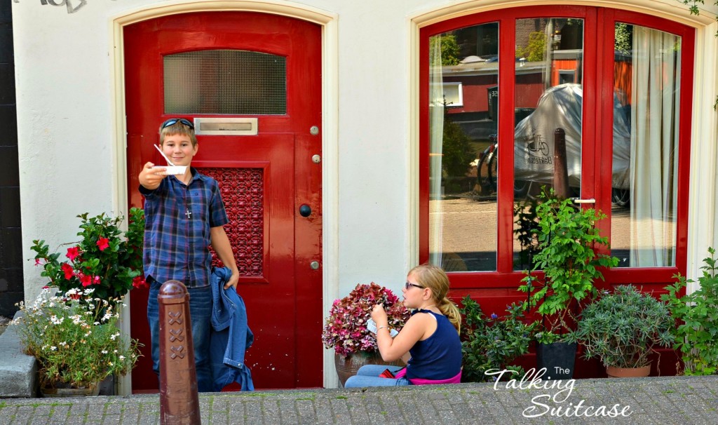 Kids handing out eating outside Swieti Sranang in Amsterdam