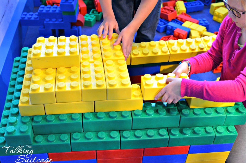 Kids building with large LEGO's in the police station jail