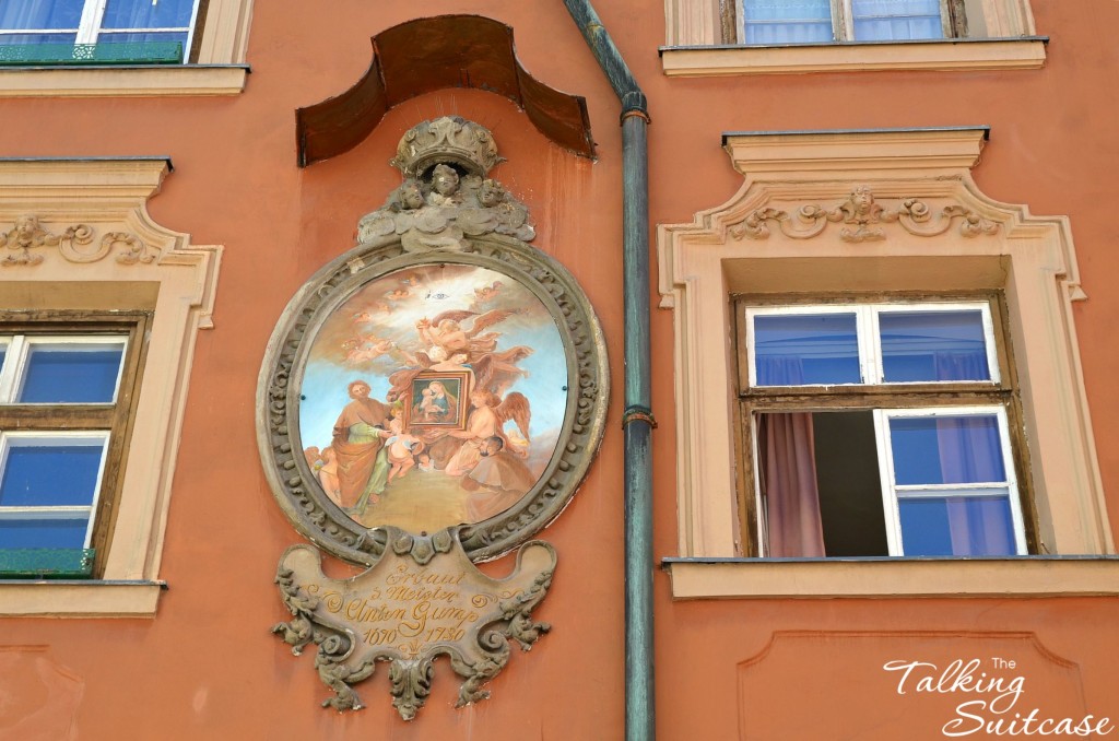 Replica of Madonna and Child within a painting on the side of the building in Innsbruck