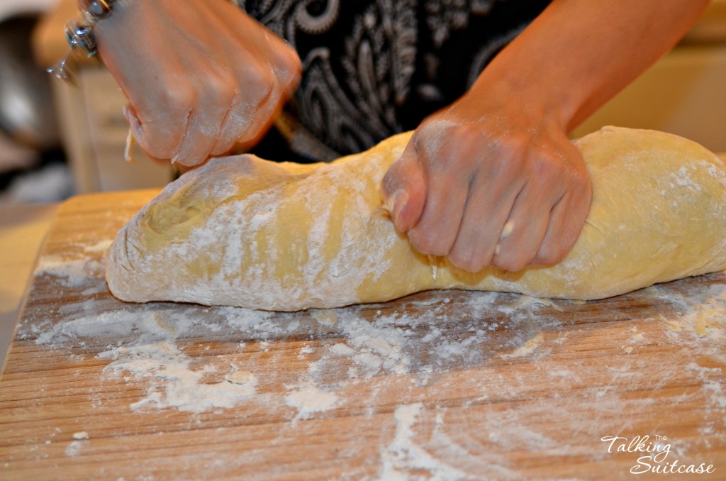 Beating dough for Thanksgiving rolls