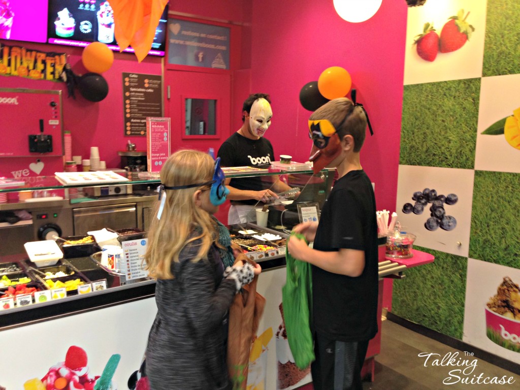 In the yogurt shop, the kids were given a scoop of candy straight into their bags.